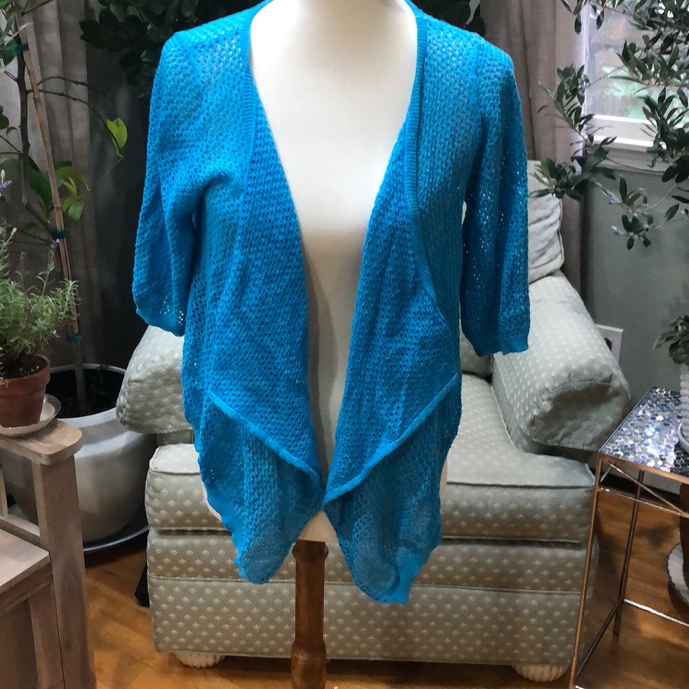 One World live and let live light sweater.